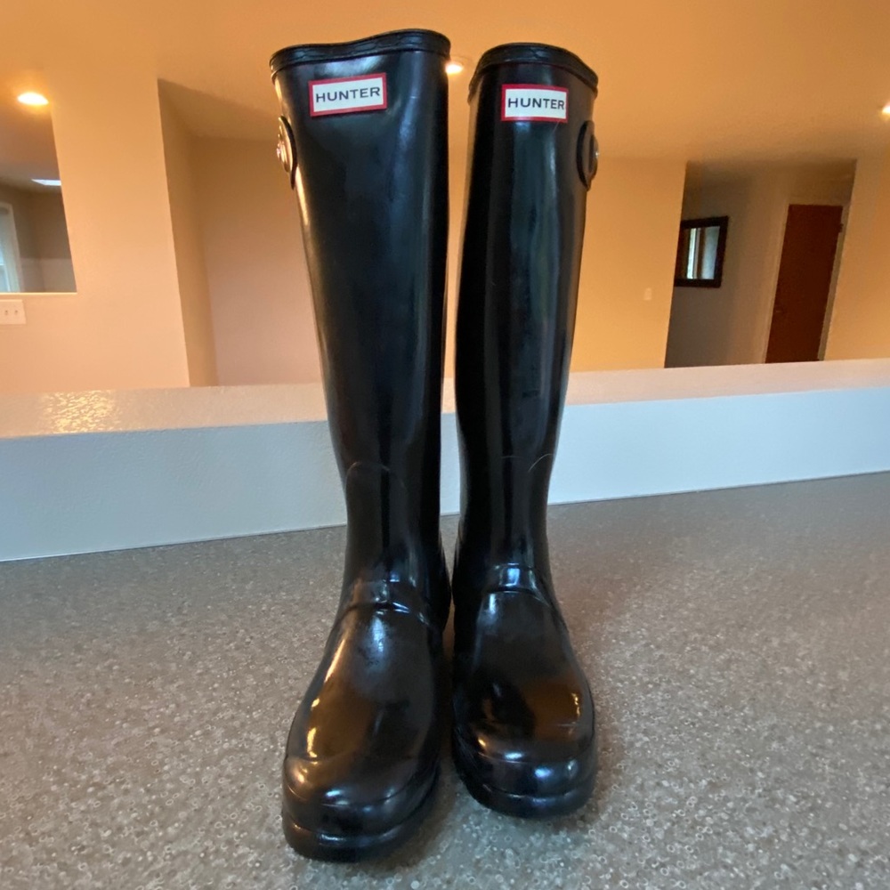 Scuffed Tall hunter boots glossy black